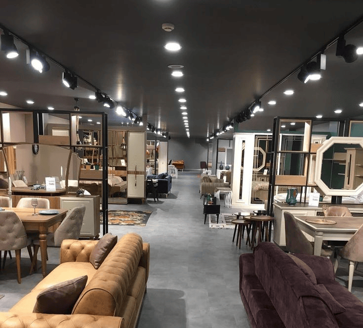 Zafar Furniture Center showroom interior with sofas, dining sets, wardrobes and mirrors